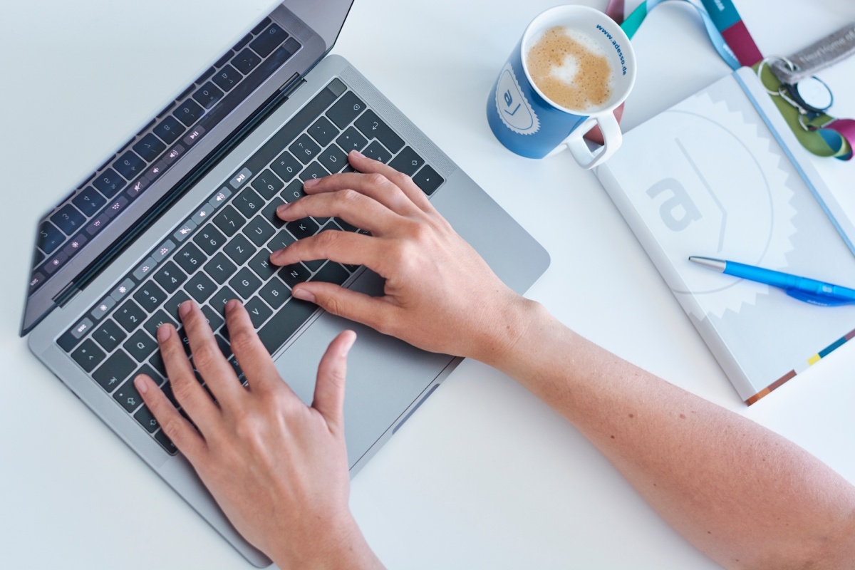 Two handy tyiping on a notebook keyboard